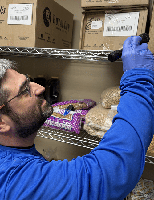 A Magnum Pest Control technician showing evidence of a residential insect infestation in New York A Magnum Pest Control technician showing evidence of a residential insect infestation in New York